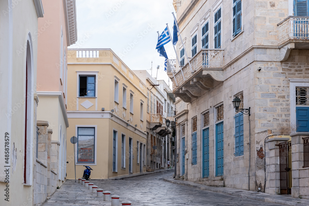 Greece. Ermoupolis Syros island. Stone paved street, neoclassical building, traditional architecture