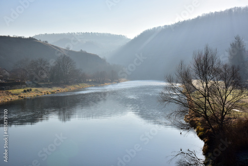 Berounka river below the village of Srbsko..River in winter with haze photo