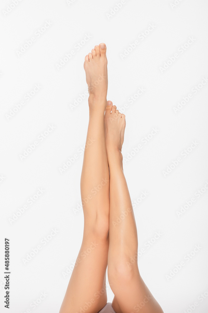partial view of woman with fit and smooth legs isolated on white partial view of woman with fit and smooth legs isolated on white