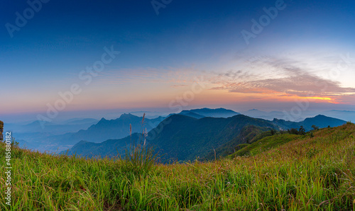 Fototapeta Naklejka Na Ścianę i Meble -  Beautiful landscape nature in morning on peak mountain with sunlight cloud fog and bright blue sky in winter at Phu Chi Fa Forest Park is a famous tourist attraction of Chiang Rai Province, Thailand