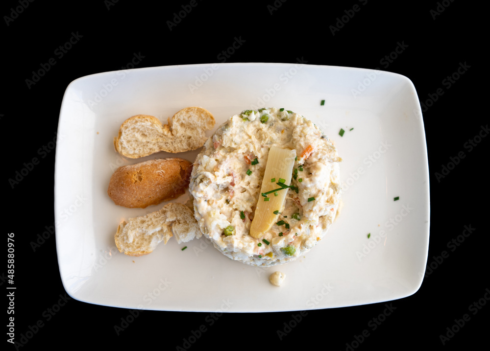 Ensaladilla russa con guarnición y ración de pan Stock Photo | Adobe Stock