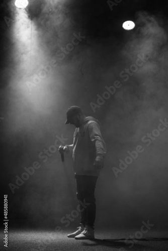 Fototapeta Naklejka Na Ścianę i Meble -  singer and rapper on stage in smoke