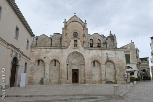 Saint Francis church in Matera, the facade in baroque style made by white sandstone with the staircase in front of the entrance door and the decorations.