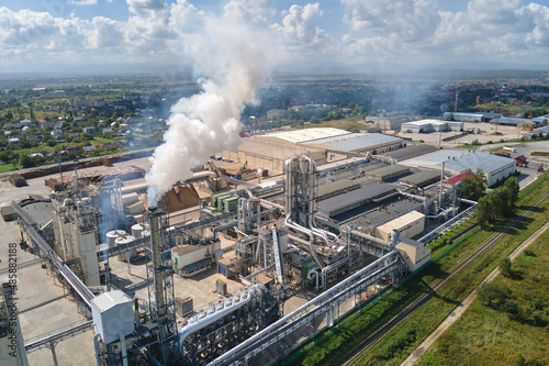 Aerial view of oil and gas refining petrochemical factory with high refinery plant manufacture structure. Global production and manufacturing concept © bilanol