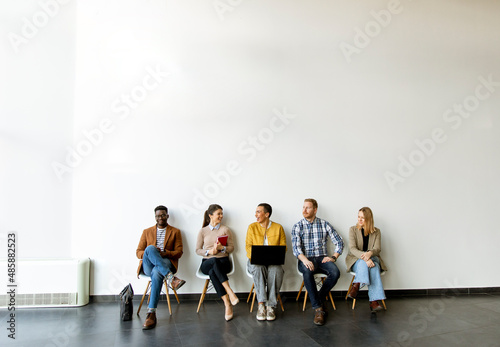 Group of bored people waiting for the job interview