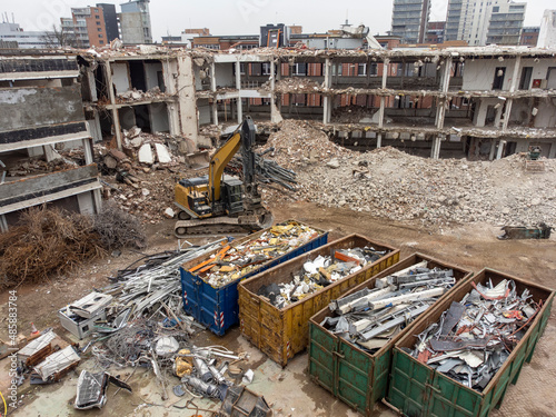 Demolition of a police station using building hydraulic shears, aerial