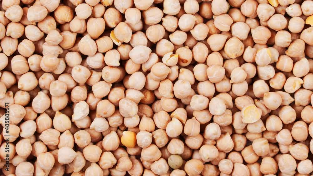 Movement of pile of raw chickpeas. View from above. Movement of pile of raw chickpeas. View from above.