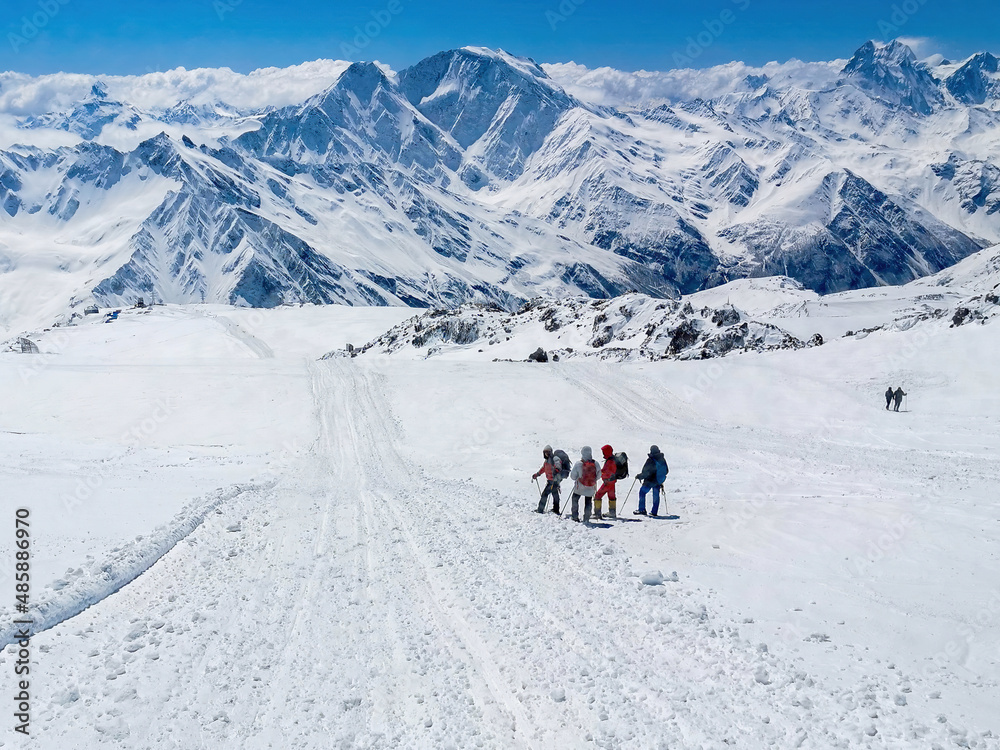 A group of climbers climbs the snowy mountain Elbrus