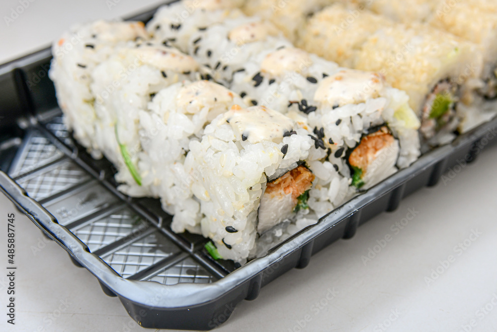 Sushi set. Various rolls, maki, nigiri in assortment in plastic packaging. Sushi set. Various rolls, maki, nigiri in assortment in plastic packaging.