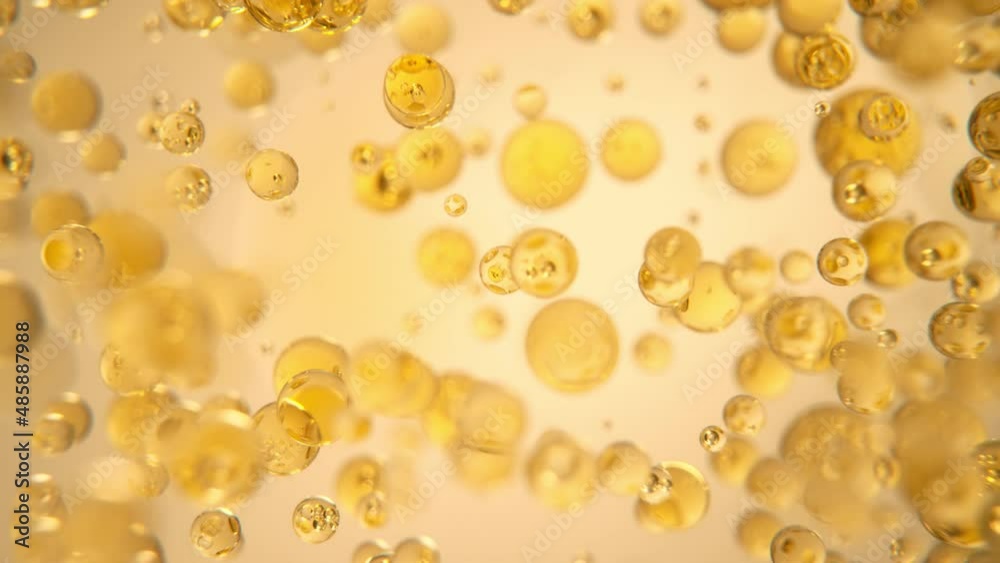 Super Slow Motion Shot of Oil Bubbles on Golden Background at 1000fps. Shoot on high speed cinema camera. Super Slow Motion Shot of Oil Bubbles on Golden Background at 1000fps. Shoot on high speed cinema camera.