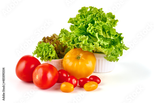 Fresh juicy tomatoes with lettuce, fresh vegetables, isolated on white background.