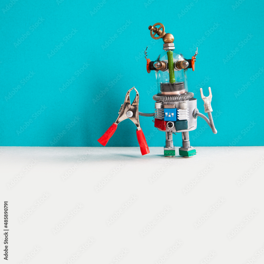 Steampunk style serviceman robot with pliers, cyan wall background. copy space