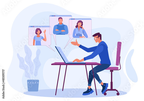 A man sits at a table with a laptop and leads an online conference webinar. Women and men participate in video conferences  communicate and learn through the Internet.