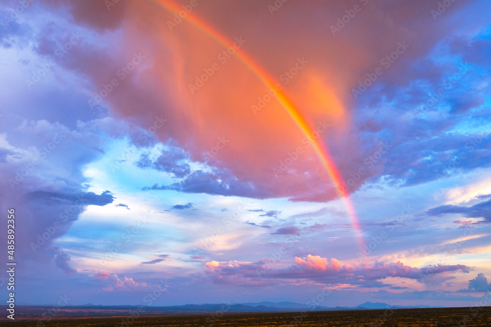 A beautiful rainbow during a sunset after a monsoon storm. 