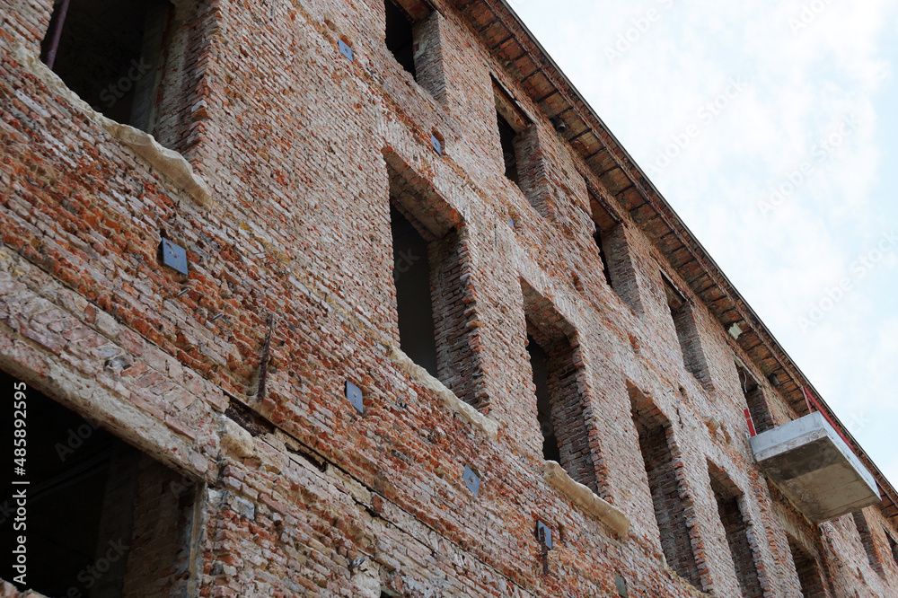 restoration of the facade of an old brick house