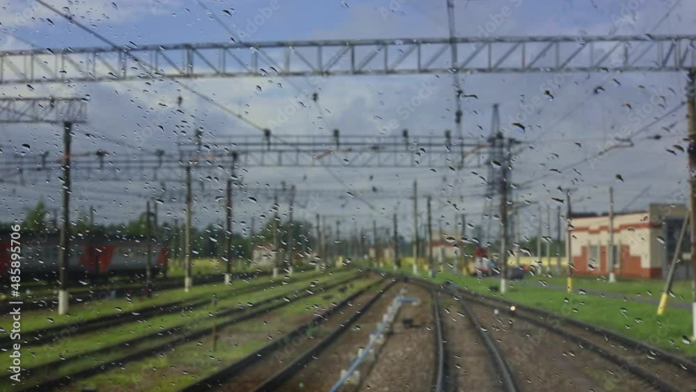 4k, view from the wet front window of a train locomotive to the railway 4k, view from the wet front window of a train locomotive to the railway