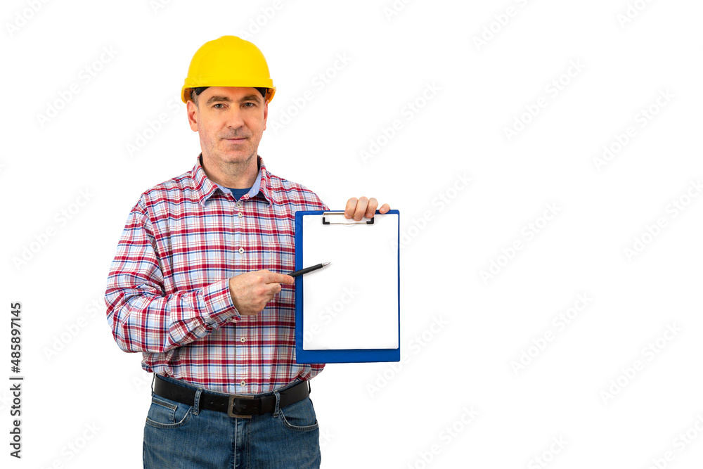 A man in a helmet holds a folder folder and ball pen with a whit A man in a helmet holds a folder folder and ball pen with a whit