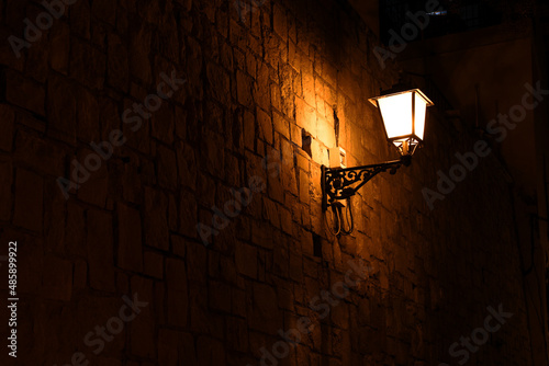 lamppost at night of the city of alicante, in the old town photo