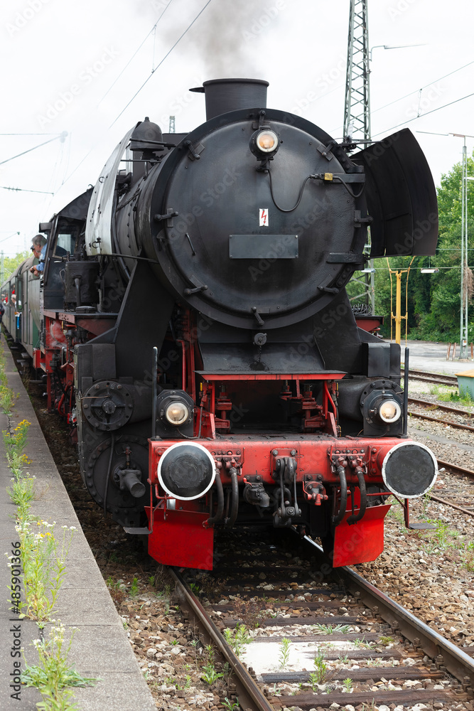 Fototapeta premium Steam locomotive with classic tubular boiler and piston steam engine