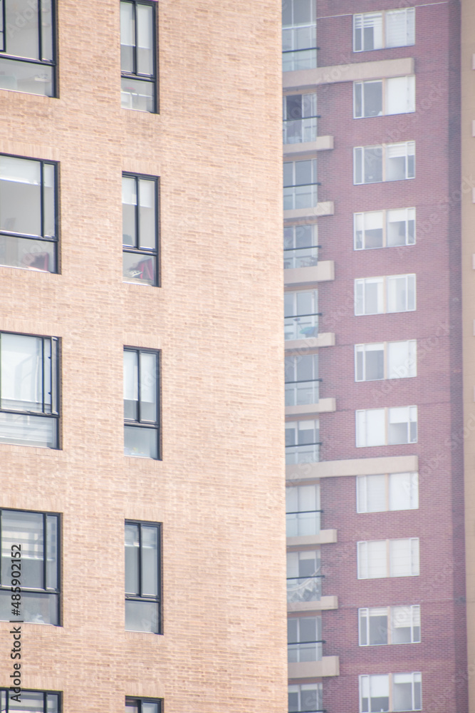 Some yellow and purple residential building as background