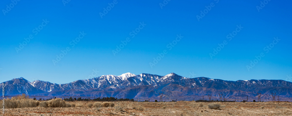 Fototapeta premium Late winter snow capped mountain range
