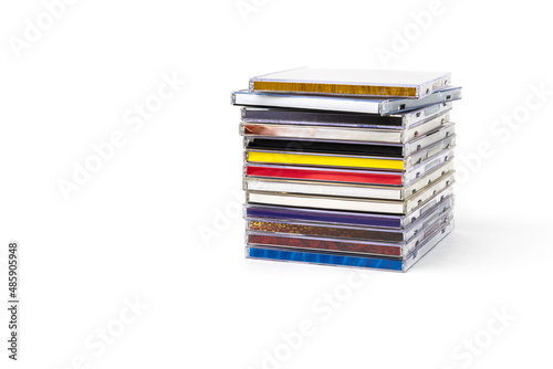 Stack of CDs in boxes on a white background.Isolate.