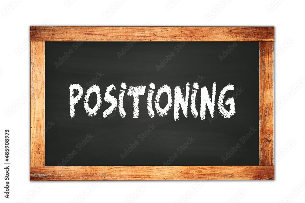 POSITIONING text written on wooden frame school blackboard. POSITIONING text written on wooden frame school blackboard.