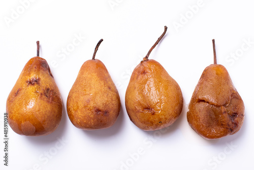 Overripe brown pears isolated on white background