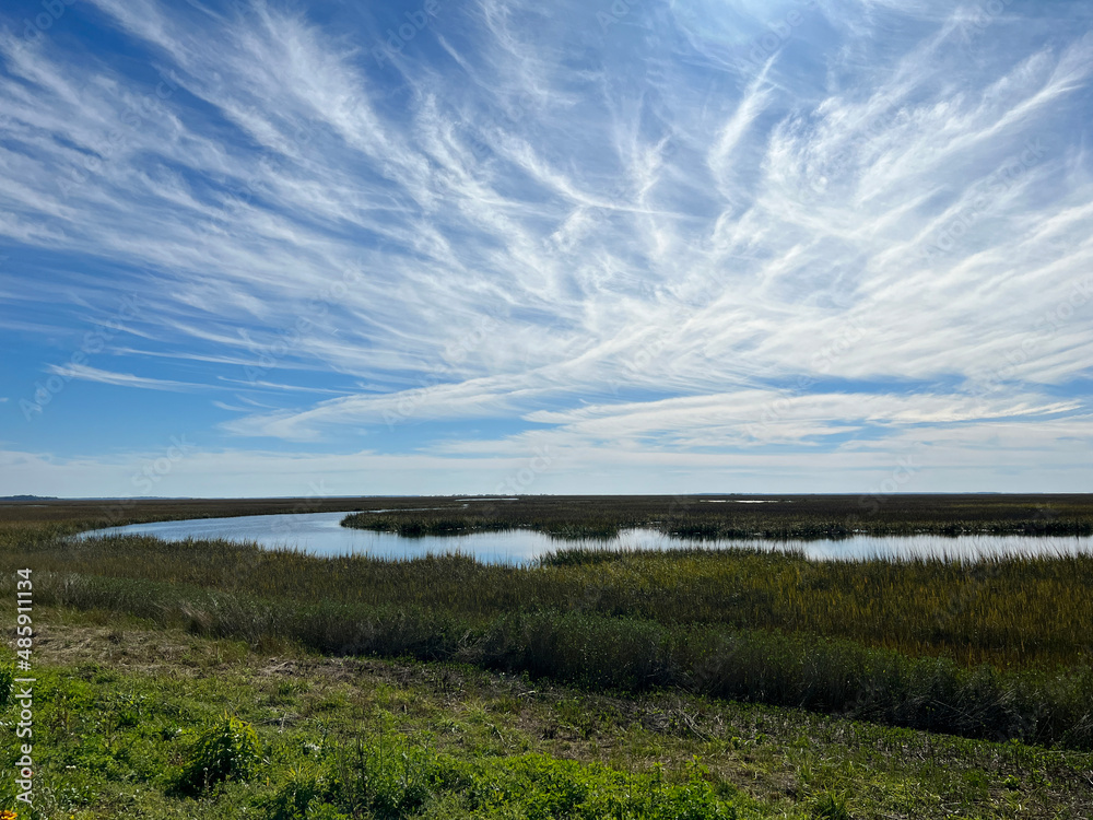 Clouds over the salt marsh on the causeway to Jekyll Island, Georgia, a popular slow travel destination.