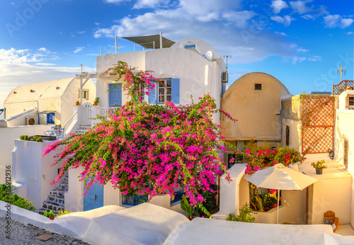 Traditional white architecture in Oia Village on Santorini Island, Greece. Scenic summer travel and vacation background.