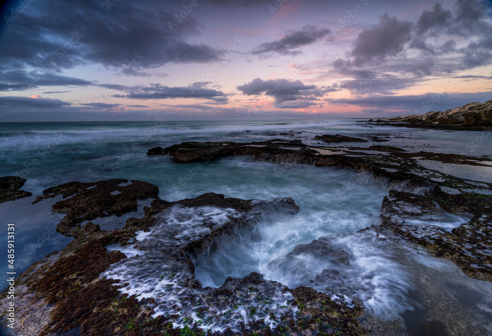 View of De Hoop Nature Reserve beautiful rocky coastline at sunrise, Western Cape, South Africa. View of De Hoop Nature Reserve beautiful rocky coastline at sunrise, Western Cape, South Africa.
