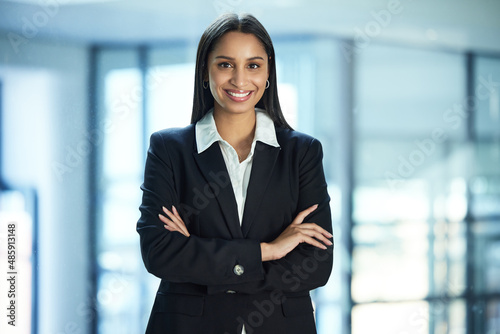 Im so happy I get to do this job. Shot of a young businesswoman in her office.