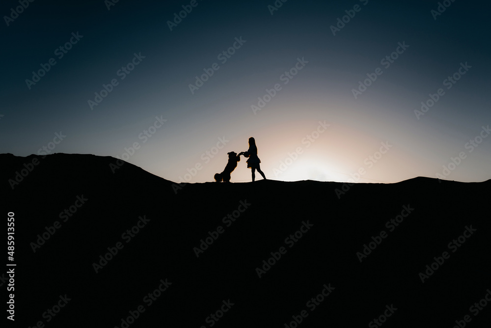 silhouette of a photographer at sunset