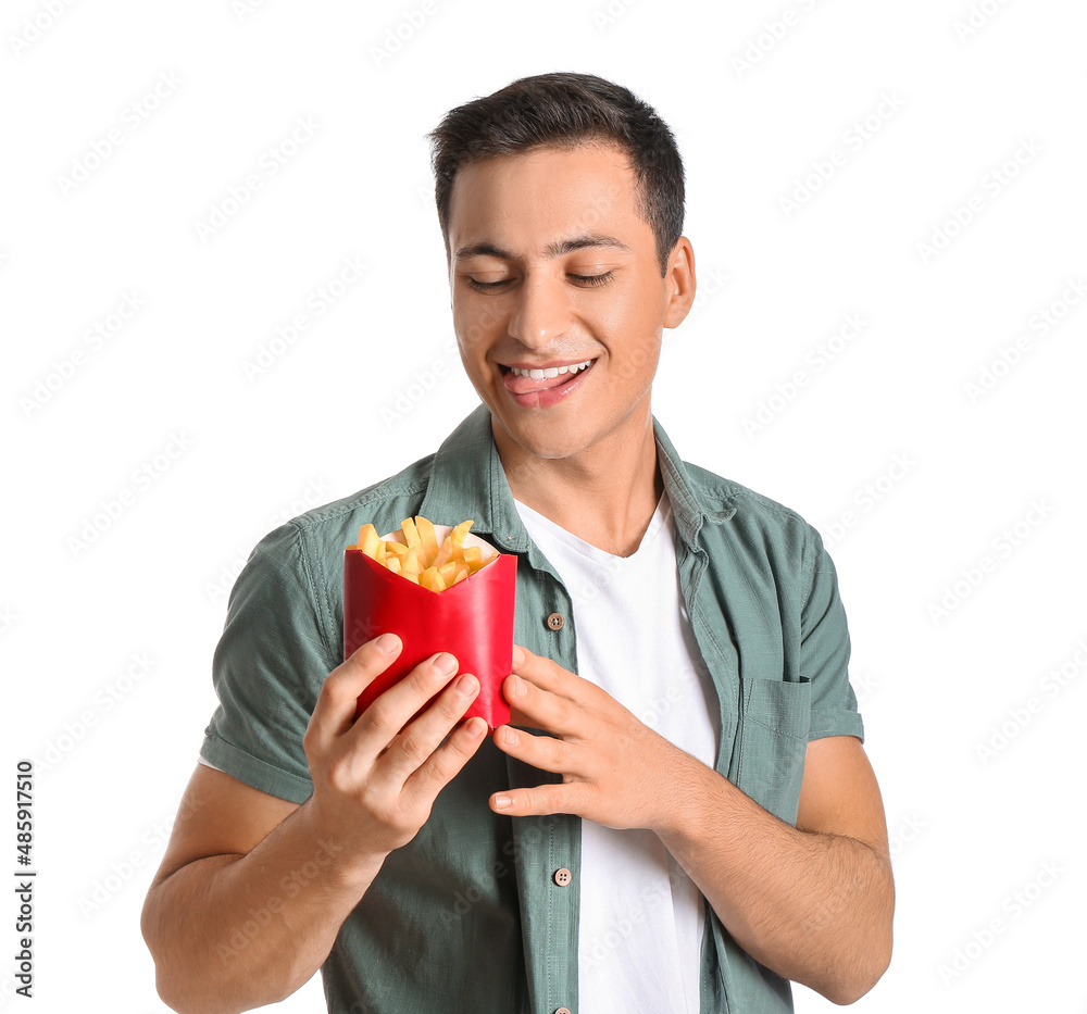 Handsome young man with french fries on white background Handsome young man with french fries on white background