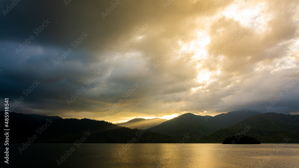 landscape Mountain with colorful vivid sunset on the cloudy sky