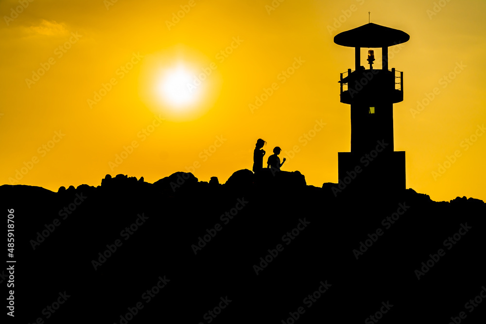 Khao Lak Light Beacon, beautiful sunset time at Nang Thong Beach , Khao Lak, Thailand. Tropical colorful sunset with cloudy sky . Patterns Texture of sand on the beach, Andaman sea Phang nga Thailand
