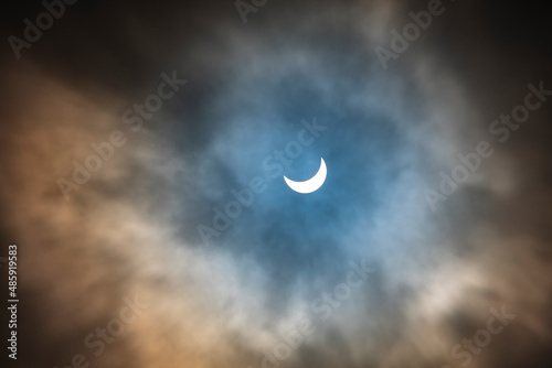 Obraz na plátně partial solar eclipse on cloudy day