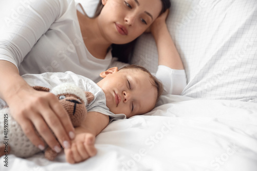 Adorable baby sleeping with...