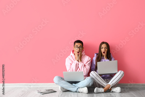 Shocked young couple with l...