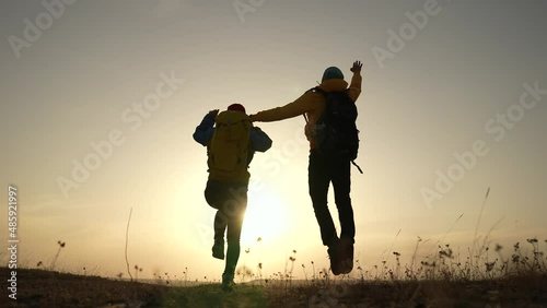 Wallpaper Mural business teamwork a freedom concept. couple of tourists run silhouette with backpacks running jumping. travel freedom business sunset fun concept. couple teamwork hikers running jumping Torontodigital.ca
