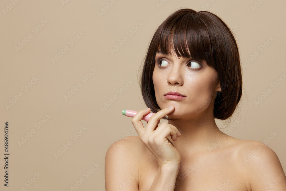 Obraz premium young woman lipstick cosmetics attractive look posing cropped view