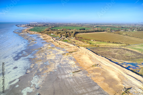 Aerial view of Climping Beach and the new temporary shingle sea defence protecting the fields of West Sussex.