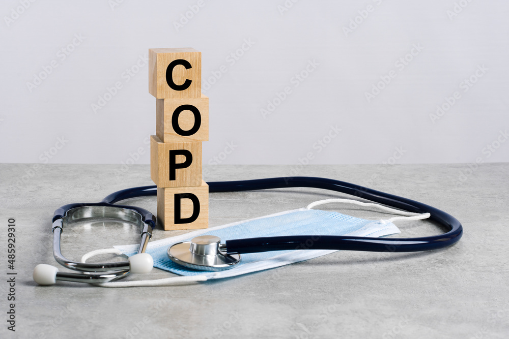 word copd is made of wooden cubes with stethoscope and medicine mask. medical concept of prevention, treatment and side effects - obrazy, fototapety, plakaty 