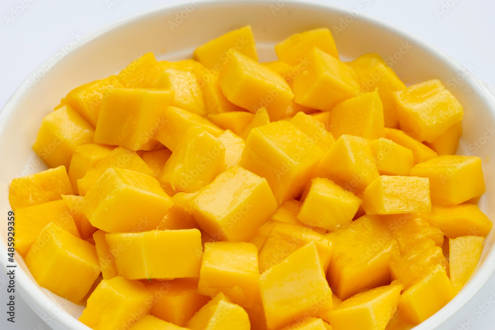Tropical fruit, Mango cube slices in white bowl on white background. Tropical fruit, Mango cube slices in white bowl on white background.