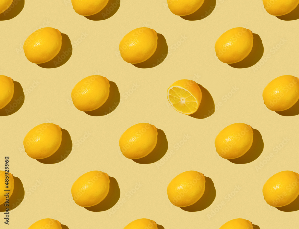 Pattern of Lemons on a yellow background - top view Pattern of Lemons on a yellow background - top view