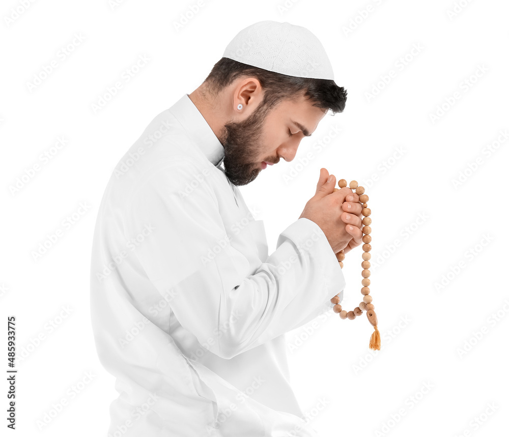 Praying young Muslim man on white background Praying young Muslim man on white background