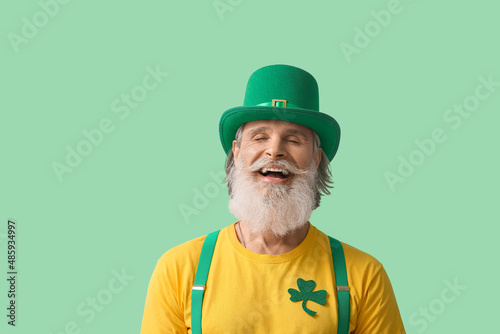 Happy senior man in hat on ...