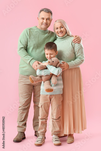 Little boy with toy and his...