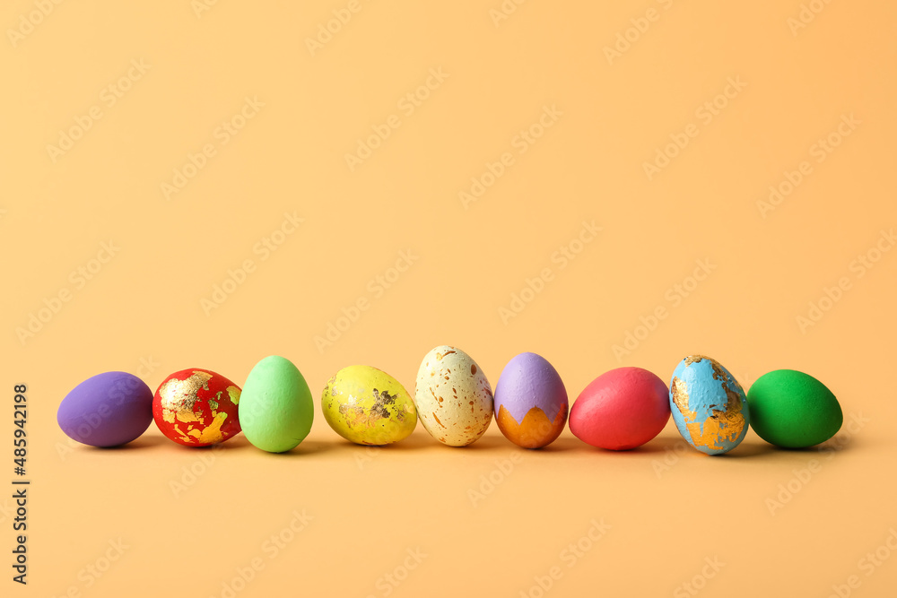 Colorful Easter eggs on beige background Colorful Easter eggs on beige background