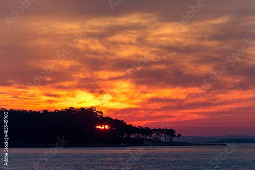 Sunset on Mansa beach looking in the direction of Isla Gorriti and the sun setting behind. Punta del Este  Maldonado  Uruguay